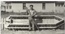  ??  ?? Karl George with the boat he made out of oil cans from his gas station