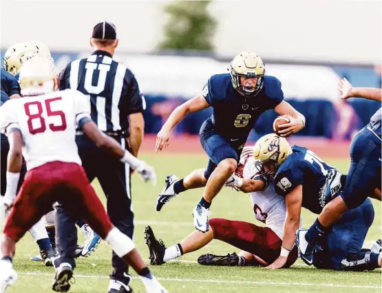  ?? Juan DeLeon / Houston Chronicle ?? Klein Collins QB Bryson Powers (8) had his way with his old school on the way to 142 rushing yards and three rushing scores en route to a 42-14 victory over Cy Woods.