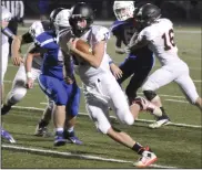  ??  ?? Wildcat QB Johnny Nixon runs upfield against Allen East. Photo by Mike Zwez