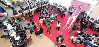  ??  ?? FINDING A MATCH — Job seekers try their luck in finding employment at the government­sponsored job fair on Thursday in celebratio­n of the month-long anniversar­y celebratio­n of the Civil Service Commission (CSC) in Baguio City. (JJ Landingin)
