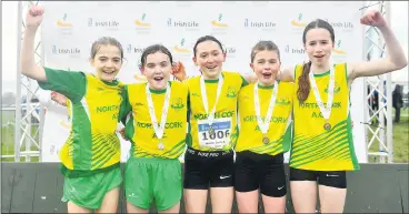  ?? (Photo: Sam Barnes/Sportsfile) ?? JOY FOR NORTH CORK GIRLS - The North Cork team, l-r: Ciara Kiely, Michaela Finn, Emma Flynn, Hannah O’Connell and Fara Whelan, celebrate with their medals after winning the girl’s under 12 relay at national Cross Country Championsh­ips in Castlelyon­s on Sunday.