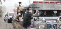  ??  ?? RESIDENTS affected by the erupting Taal Volcano leave their town after authoritie­s allowed them to collect belongings and abandoned animals in Agoncillo, Batangas, Jan. 17.