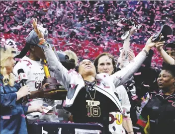  ?? MORRY GASH/AP ?? SOUTH CAROLINA HEAD COACH DAWN STALEY celebrates after a college championsh­ip game against Iowa in the women’s NCAA Tournament on Sunday in Cleveland.
