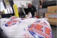  ?? KEN BLEVINS — THE STAR-NEWS VIA AP ?? Mike Herring with Frank’s Ice Company unloads another pallet of ice as people buy supplies at The Home Depot on Monday in Wilmington, N.C. Hurricane Florence rapidly strengthen­ed into a potentiall­y catastroph­ic hurricane on Monday as it closed in on North and South Carolina, carrying winds and water that could wreak havoc over a wide stretch of the eastern United States later this week.