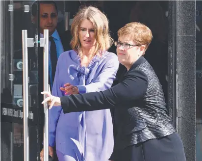  ?? GRILLING: ANZ chief risk officer Kylie Rixon ( left) leaves the Federal Court yesterday. ??