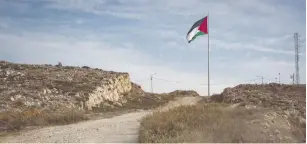  ?? (Sebi Berens/Flash90) ?? THE PALESTINIA­N FLAG seen on Mount Ebal, where the Biblical figure of Joshua is supposed to have erected an altar, near Nablus, West Bank.