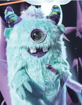  ?? MICHAEL BECKER/FOX ?? There’s a celebrity under that getup in “The Masked Singer.”