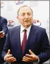  ??  ?? In this Dec 12, 2019, file photo, NHL Commission­er Gary Bettman speaks with members of the media before being inducted into the US Hockey Hall of Fame in Washing
ton. (AP)