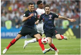  ?? AP ?? Croatia’s Dejan Lovren ( left) and Sime Vrsaljko block Marcus Rashford of England in their semi- final at the Luzhniki Stadium in Moscow on Wednesday. —