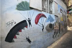  ?? PHOTOGRAPH: LINA MALERS ?? ▲ Nihaya Ibrahim’s mural in Burj al-Barajneh refugee camp depicting Hamas and Palestine’s flag colours