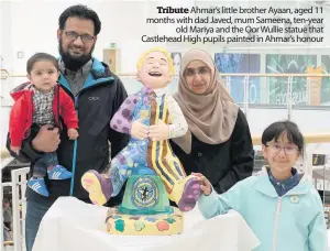  ??  ?? Tribute Ahmar’s little brother Ayaan, aged 11 months with dad Javed, mum Sameena, ten-year
old Mariya and the Oor Wullie statue that Castlehead High pupils painted in Ahmar’s honour