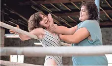  ?? ERICA PARISE, NETFLIX ?? Ruth Wilder (Alison Brie) gets slapped around the ring by Carmen Wade (Britney Young) in GLOW.