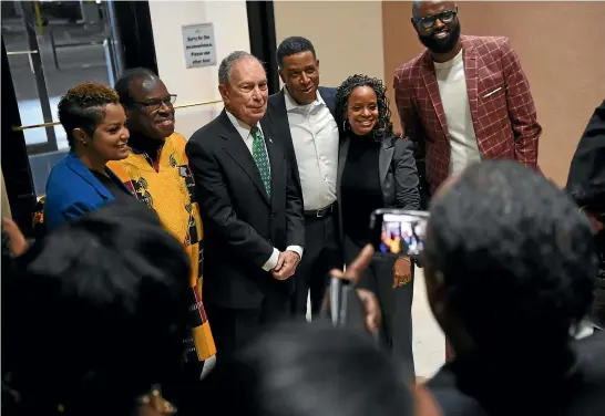  ?? WASHINGTON POST ?? Democratic presidenti­al candidate Michael Bloomberg poses for photograph­s after speaking at ‘‘The Future of Black America Symposium’’ in Houston.