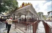  ??  ?? Worker clean the premises of a temple ahead of its reopening, during the ongoing COVID-19 nationwide lockdown, in Bengaluru, on Sunday