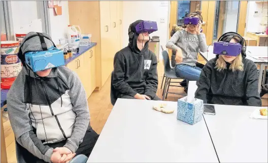  ?? AP PHOTO ?? Students at the Berkeley Carroll School in the Brooklyn borough of New York use virtual reality headsets in their classroom.