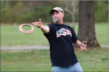  ?? AUSTIN HERTZOG - MEDIANEWS GROUP ?? Tim Joyce pitches a quoit while practicing the English version of the sport recently in North Coventry.