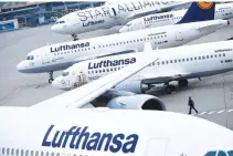  ??  ?? LUFTHANSA AIRPLANES are parked on the tarmac during a strike by cabin crew union (UFO) at Frankfurt airport, Germany on Nov. 13, 2015.