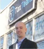  ??  ?? Moose Jaw TaxTeam manager Michael Biette outside the firm’s new office location, 339 Main St.