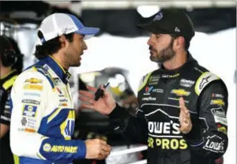  ?? DERIK HAMILTON — THE ASSOCIATED PRESS ?? Jimmie Johnson, right, talks to Chase Elliott in the garage area during Sunday’s NASCAR Cup Series Pocono 400 on Friday in Long Pond. practice for