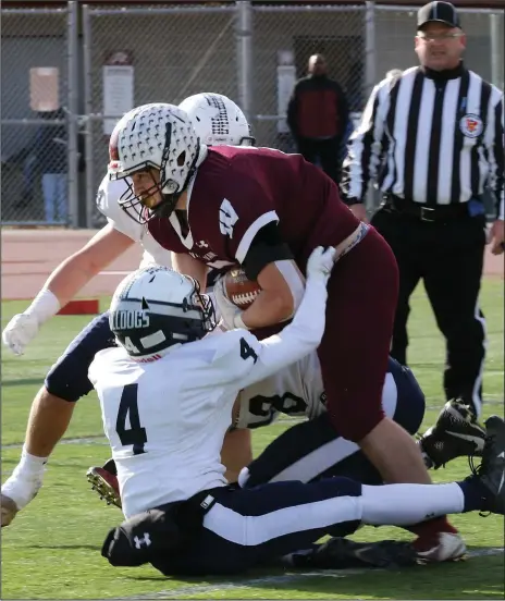  ?? Photo courtesy of Jackie L. Turner
/ Westerly Sun ?? Westerly’s Isaiah Luzzi (4) attempts to tackle Woonsocket’s Logan Coles during the 2018 Division II semifinal-round contest at East Greenwich High School. After getting destroyed by 40 points by the Bulldogs during the regular season, Coles and the Novans flipped the script with a come-frombehind 22-21 victory that earned Woonsocket a spot in that year’s Division II Super Bowl.