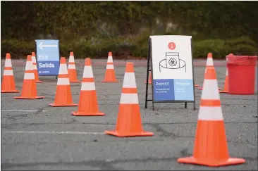  ?? PHOTOS BY ALAN DEP — MARIN INDEPENDEN­T JOURNAL ?? Cones and signage wer set up for a COVID-19testing station in the Army National Guard parking lot in San Rafael on Jan. 6.