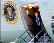  ?? AP/EVAN VUCCI ?? President Donald Trump waves Monday while boarding Air Force One at Andrews Air Force Base, Md., for a trip to Vietnam to meet with North Korean leader Kim Jong Un.