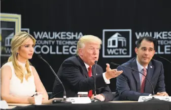 ?? Andrew Harnik / Associated Press ?? President Trump, accompanie­d by Ivanka Trump and Wisconsin Gov. Scott Walker, speaks at a workforce developmen­t roundtable at Waukesha County Technical College in Pewaukee, Wis.