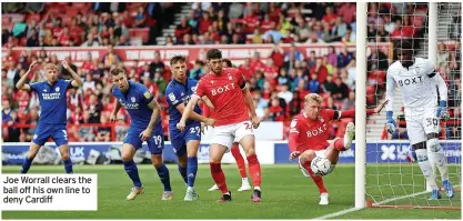  ??  ?? Joe Worrall clears the ball off his own line to deny Cardiff