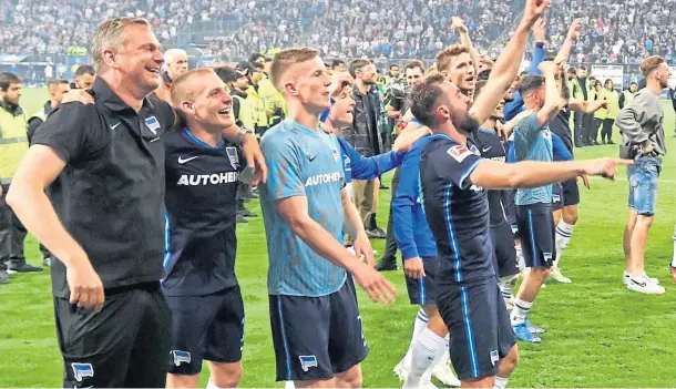  ?? ?? HERR WE GO: Hertha Berlin players and staff celebrate after winning Germany’s Bundesliga relegation play-off against Hamburg.