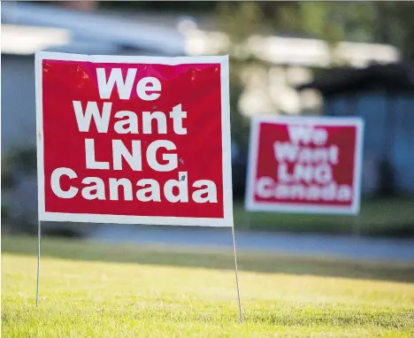  ?? BEN NELMS/BLOOMBERG FILES ?? Signs reading “We Want LNG Canada” stand on a lawn in Kitimat, B.C. last year. Shell Canada Ltd.-led LNG Canada project is bracing for the possibilit­y it will get the green light to “meet that new wave of demand.” LNG Canada says the project will be...