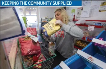  ?? Photo by Domnick Walsh ?? Staff member Carol Daly gets food ready for delivery at the ‘Halfway shop’ in Ballymacel­ligott. The shop, Local Link Kerry and the Ballymacel­ligott Support Group are working together to deliver groceries to locals every Tuesday and Friday during the COVID-19 lock-down.