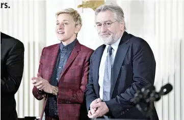  ??  ?? Robert De Niro and Ellen DeGeneres at the Presidenti­al Medal of Freedom ceremony in the White House in November 2016. — Bloomberg photo by Andrew Harrer