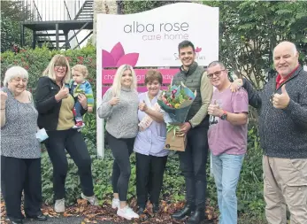  ?? ?? Judith Horrigan is pictured with Saint Cecilia’s Care Group director Aaron Padgham and family and friends.