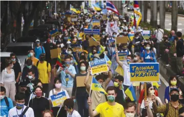  ?? (Ann Wang/Reuters) ?? PEOPLE ATTEND a rally in Taipei last month, against Russia’s invasion of Ukraine.