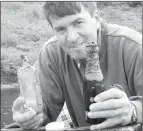  ?? — Submitted photos ?? Paul Peddle of Burgeo holds a few bottles fished from the bottom of a cove along the south coast.
