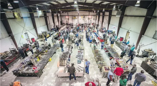  ?? PHOTOS: BRANDON HARDER ?? At the River Ridge Fish and Game Gun Show in Canora, the rules and the gun selection are different than in the U.S., but the vendors’ politics remain similar.