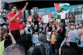  ?? ?? Pro-Palestinia­n protesters rally outside CNN’s headquarte­rs in Atlanta, Georgia, on 14 October 2023. Photograph: John Arthur Brown/Zuma Press via Alamy