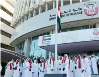  ?? Photo by Ryan Lim ?? Employees of the Department of Finance gather for the UAE Flag Day celebratio­ns in Abu Dhabi. —