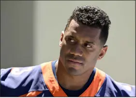  ?? ANDY CROSS — THE DENVER POST ?? Broncos quarterbac­k Russell Wilson addresses the media after OTAS at Centura Health Training Center last month.