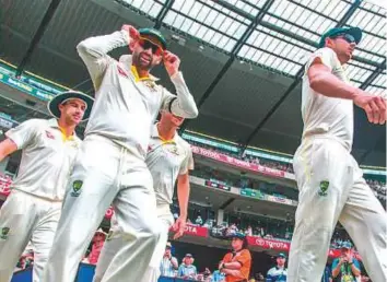  ?? Rex Features ?? ■ Nathan Lyon (left), who was recalled to the ODI squad for the first time since 2016, said he expected England fans to take full advantage of the ball-tampering scandal in South Africa.