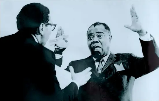  ??  ?? IT’S A WONDERFUL WORLD: Orenstein, left, directs jazz giant Louis Armstrong for his recording of the jingle for Topper Toys’ very popular Suzy Cute doll.