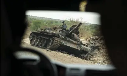  ?? ?? A destroyed tank by the side of the road in western Tigray earlier this year. Photograph: Ben Curtis/AP