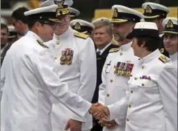  ?? ANDREW VAUGHAN, THE CANADIAN PRESS ?? Vice Admiral Mark Norman, left, greets officers in Halifax in 2013. An affidavit indicates that the RCMP suspect Norman of leaking secret government documents.