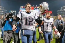  ?? KEITH SRAKOCIC/AP PHOTO ?? Patriots quarterbac­k Tom Brady (12) celebrates with center Ted Karras (75) as they leave the field after defeating the Steelers 27-24 in Sunday’s game at Pittsburgh.