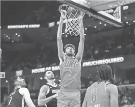  ?? PETRE THOMAS/USA TODAY SPORTS ?? Thunder forward Chet Holmgren dunks during the first half against the Grizzlies on Saturday at FedExForum in Memphis, Tenn.