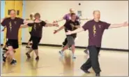  ?? DIGITAL FIRST MEDIA FILE PHOTO ?? Charles Brynan, of Pear Garden Tai Chi & Reflexolog­y, far right, leads a tai chi class at the Pottstown YMCA. The Philadelph­ia Freedom Valley YMCA has announced that it will close its Pottstown branch in June 2018, citing $11 million in repairs that...