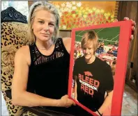  ?? Arkansas Democrat-Gazette/STATON BREIDENTHA­L ?? Piper Partridge holds a photo of her son, Keagan Schweikle, 17, who was shot and killed last year by a Benton police officer.