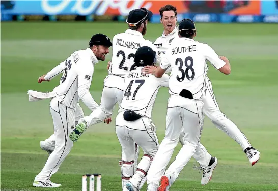  ?? GETTY IMAGES ?? Mitchell Santner celebrates taking the winning wicket in the Boxing Day test last year against Pakistan with his Black Caps team-mates.