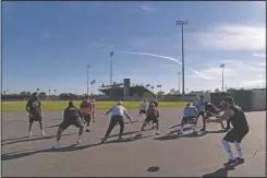  ??  ?? El Modena payers run a drill before the game.