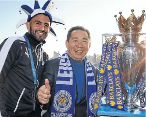  ?? Picture: Getty/Plumb Images/Leicester City ?? Riyad Mahrez of Leicester City with chairman Vichai Srivaddhan­aprabha at Victoria Park, Leicester, during the Premier League winners bus parade in 2016.